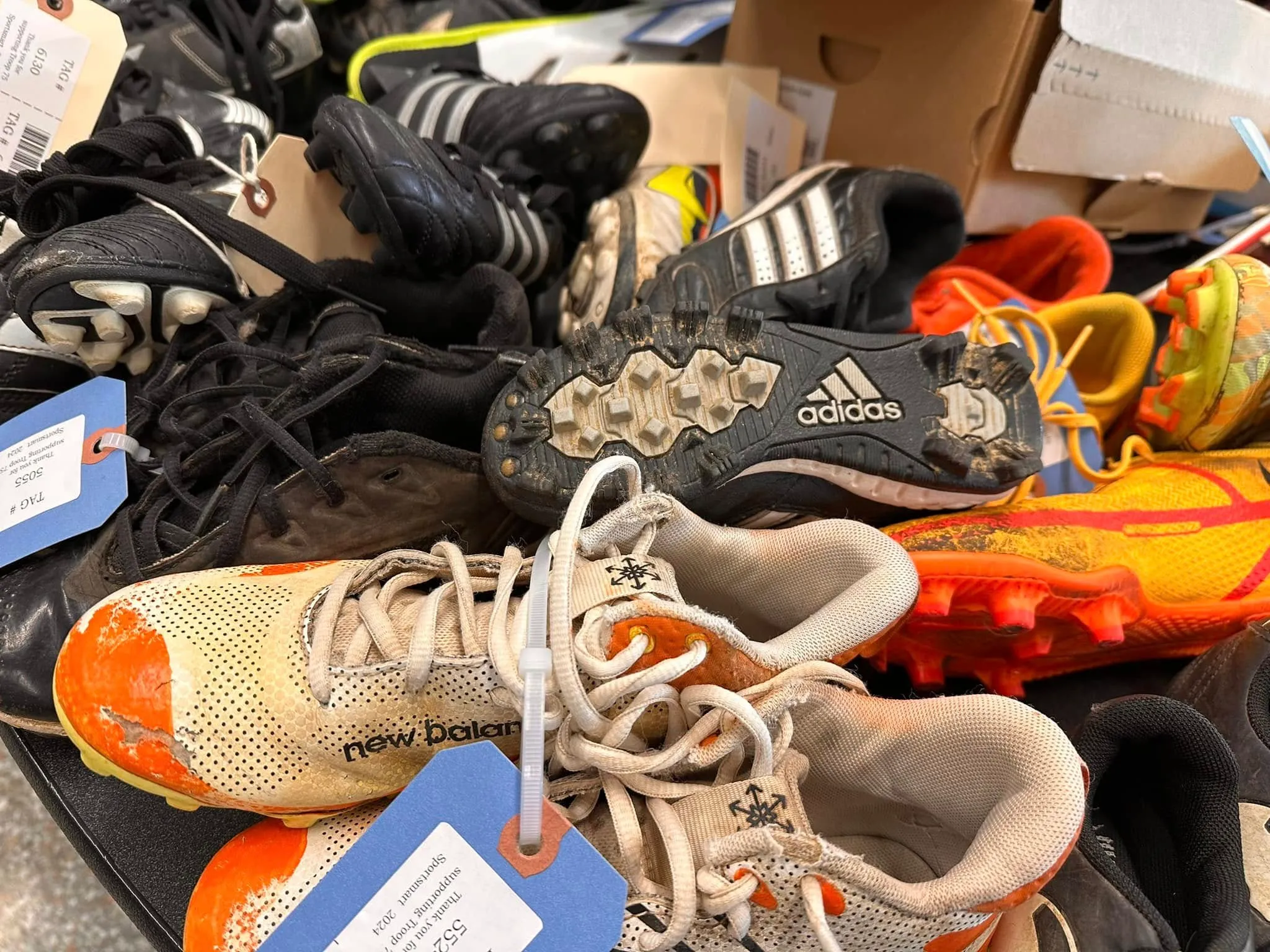 Soccer and football cleats with Sportsmart tags